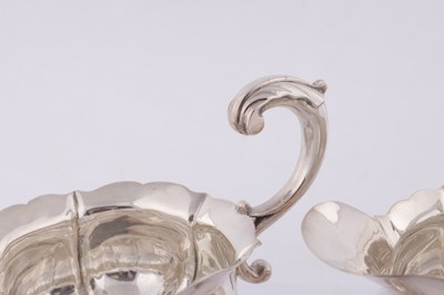 Lot 395 - JOHN POLLOCK, LONDON. A PAIR OF GEORGE III SILVER GRAVY BOATS