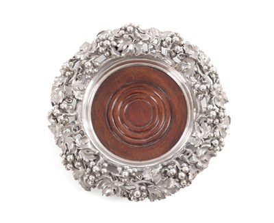 Lot 385 - MORTIMER & HUNT, LONDON. A VICTORIAN MAHOGANY AND SILVER BOTTLE COASTER