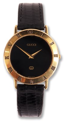 Lot 175 - A gentleman's GUCCI WRISTWATCH with black dial...