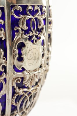 Lot 375 - A LATE 18TH/19TH STERLING SILVER AND BLUE GLASS SUGAR BOWL