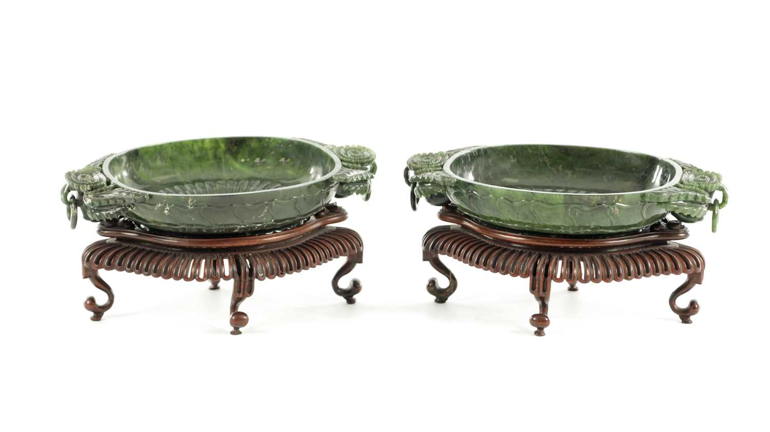Lot A PAIR OF LATE QING DYNASTY CHINESE JADE DISHES ON STANDS