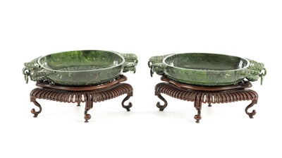 Lot A PAIR OF LATE QING DYNASTY CHINESE JADE DISHES ON STANDS