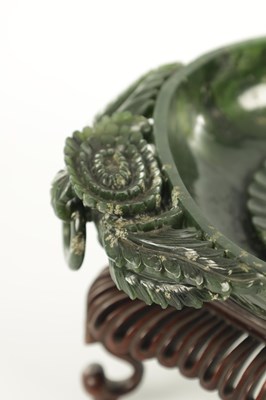 Lot A PAIR OF LATE QING DYNASTY CHINESE JADE DISHES ON STANDS