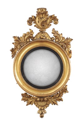 Lot 1321 - A GOOD LATE REGENCY CARVED GILTWOOD CONVEX HANGING MIRROR