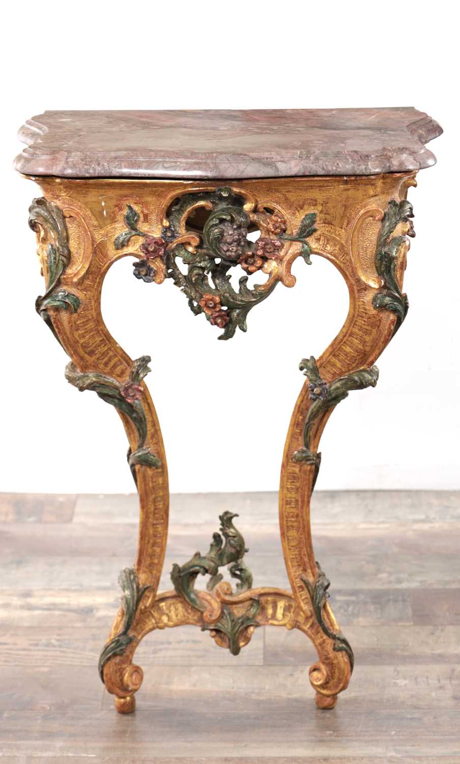 Lot 1201 - AN 18TH CENTURY ITALIAN CARVED GILTWOOD AND POLYCHROME DECORATED CONSOLE TABLE OF SMALL SIZE