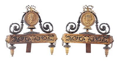 Lot 57 - A PAIR OF EARLY 19TH CENTURY FRENCH CAST IRON AND GILT BRONZE CHENETS