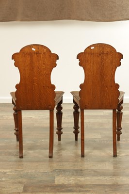 Lot 197 - A PAIR OF 19TH CENTURY OAK HALL CHAIRS