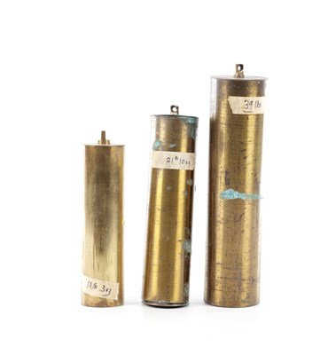 Lot 104 - A SET OF THREE EDWARDIAN BRASS CASED LONGCASE CLOCK WEIGHTS