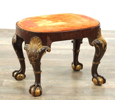 Lot 1181 - A GEORGE II STYLE MAHOGANY AND PARCEL GILT STOOL