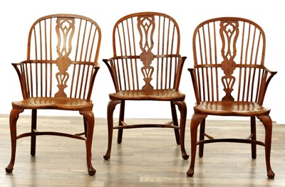 Lot 1280 - A SET OF THREE EARLY 19TH CENTURY YEW WOOD WINDSOR CHAIRS