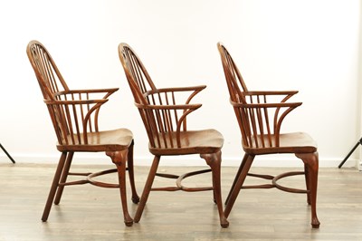 Lot 1280 - A SET OF THREE EARLY 19TH CENTURY YEW WOOD WINDSOR CHAIRS