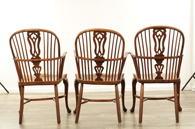 Lot 1280 - A SET OF THREE EARLY 19TH CENTURY YEW WOOD WINDSOR CHAIRS