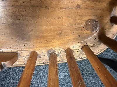 Lot 1280 - A SET OF THREE EARLY 19TH CENTURY YEW WOOD WINDSOR CHAIRS