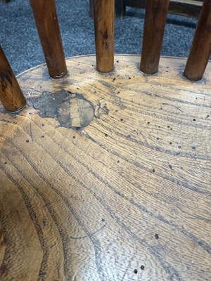 Lot 1280 - A SET OF THREE EARLY 19TH CENTURY YEW WOOD WINDSOR CHAIRS