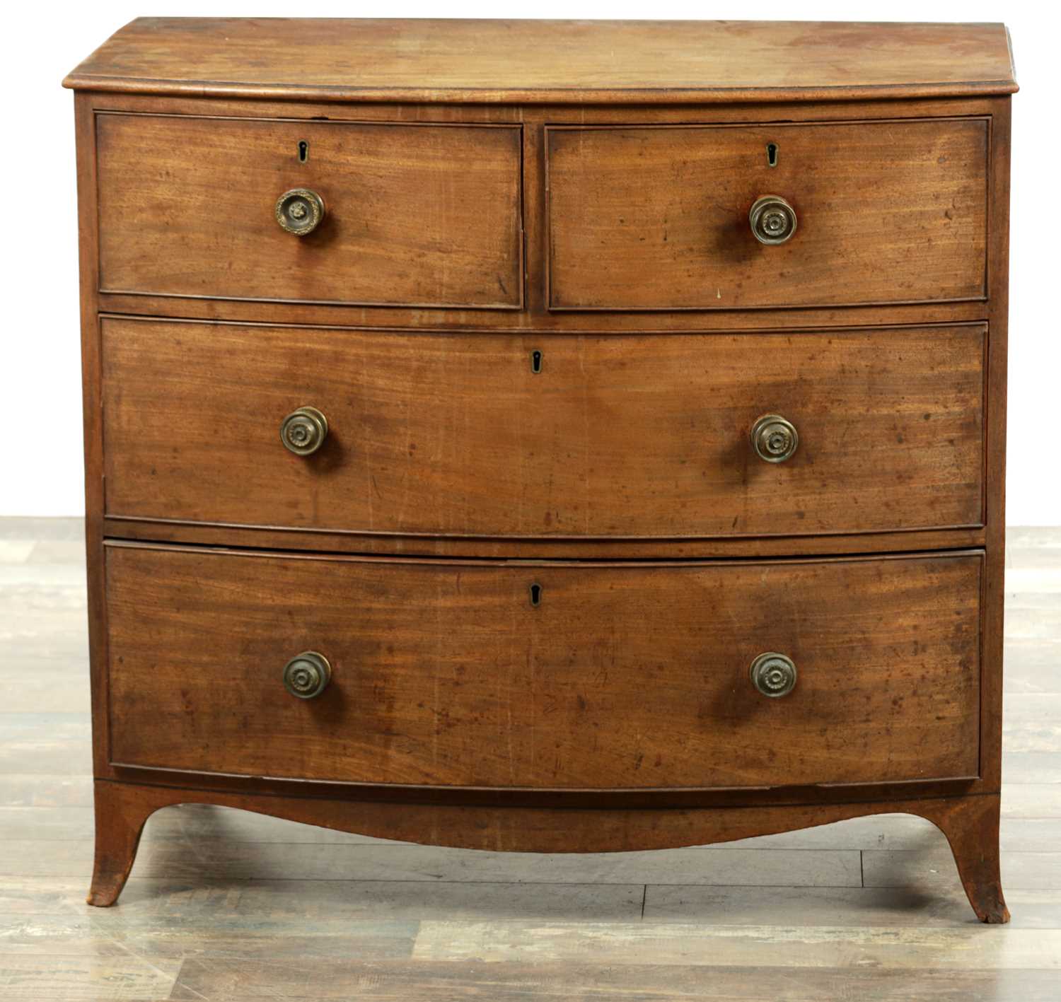Lot 83 - A LATE GEORGIAN BOW-FRONTED MAHOGANY CHEST OF DRAWERS