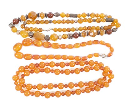Lot 192 - A COLLECTION OF THREE AMBER BEAD NECKLACES