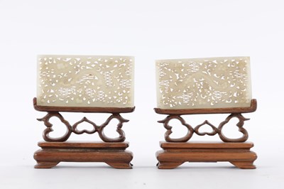 Lot 69 - A PAIR OF CHINESE RETICULATED CARVED JADE PANELS ON STANDS