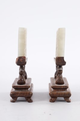 Lot 69 - A PAIR OF CHINESE RETICULATED CARVED JADE PANELS ON STANDS