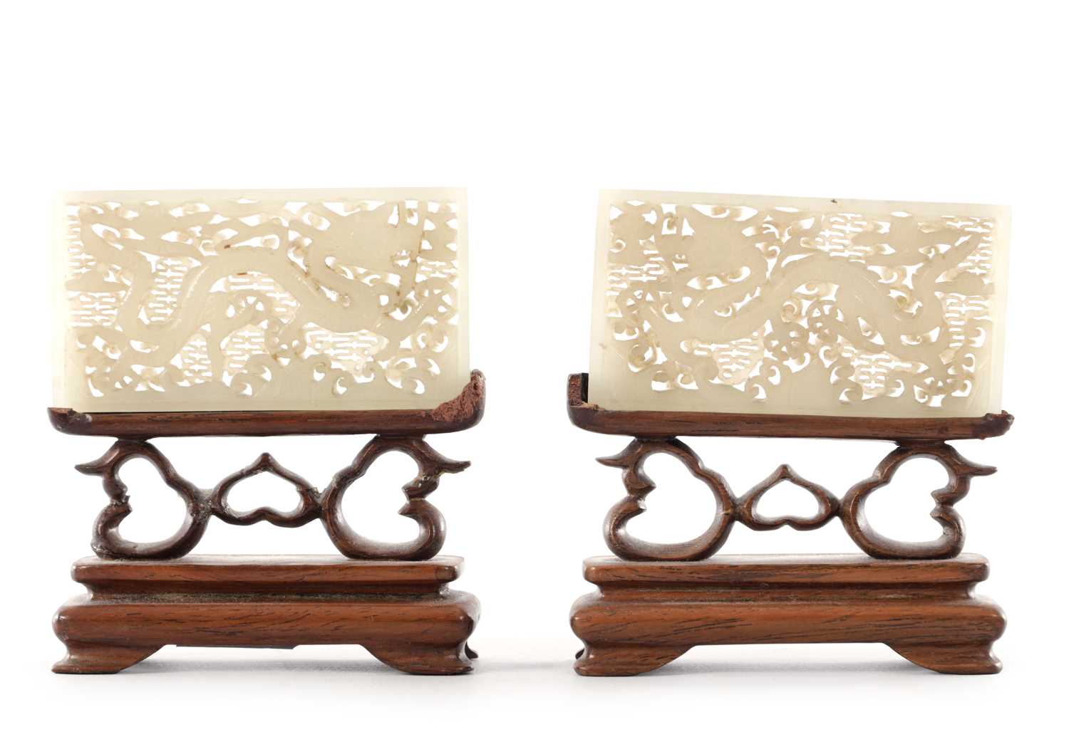 Lot 69 - A PAIR OF CHINESE RETICULATED CARVED JADE PANELS ON STANDS