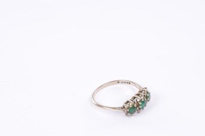 Lot 261 - A VICTORIAN 18CT WHITE GOLD THREE-STONE EMERALD AND DIAMOND CLUSTER RING