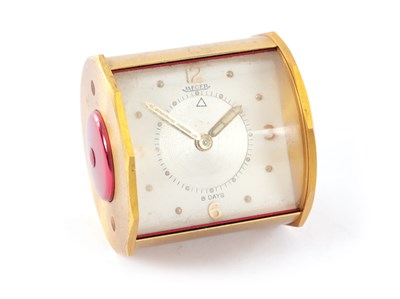 Lot 18 - A JAEGER EIGHT-DAY CYLINDRICAL DESK TOP ALARM CLOCK