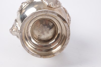 Lot 451 - A SET OF FOUR GEORGE V CAST SILVER PEPPERS