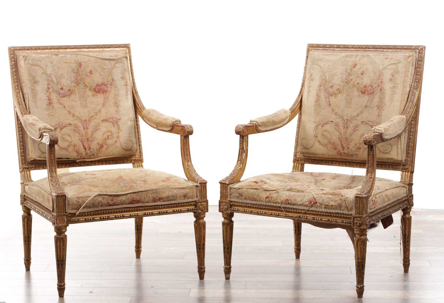 Lot 1206 - A PAIR OF 18TH CENTURY FRENCH CARVED GILT GESSO ARMCHAIRS UPHOLSTERED IN AUBUSSON TAPESTRIES