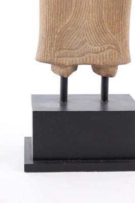 Lot 136 - AN EARLY 12/13TH CENTURY CARVED CAMBODIAN SANDSTONE FIGURAL SCULPTURE