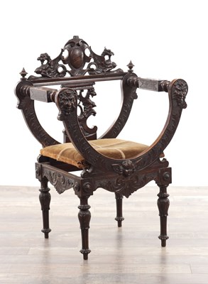 Lot 330 - A 19TH CENTURY CARVED WALNUT X FRAMED ARMCHAIR