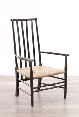 Lot 1301 - AN EARLY 20TH CENTURY EBONISED WOOD SUSSEX ARMCHAIR