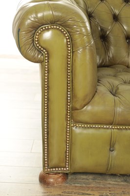 Lot 1172 - AN EARLY 20TH CENTURY GREEN LEATHER THREE SEATER CHESTERFIELD SETTEE