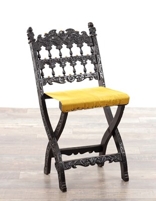 Lot 1208 - AN 18TH CENTURY DUTCH COLONIAL CARVED EBONY AND APPLIED IVORY FOLDING CHAIR