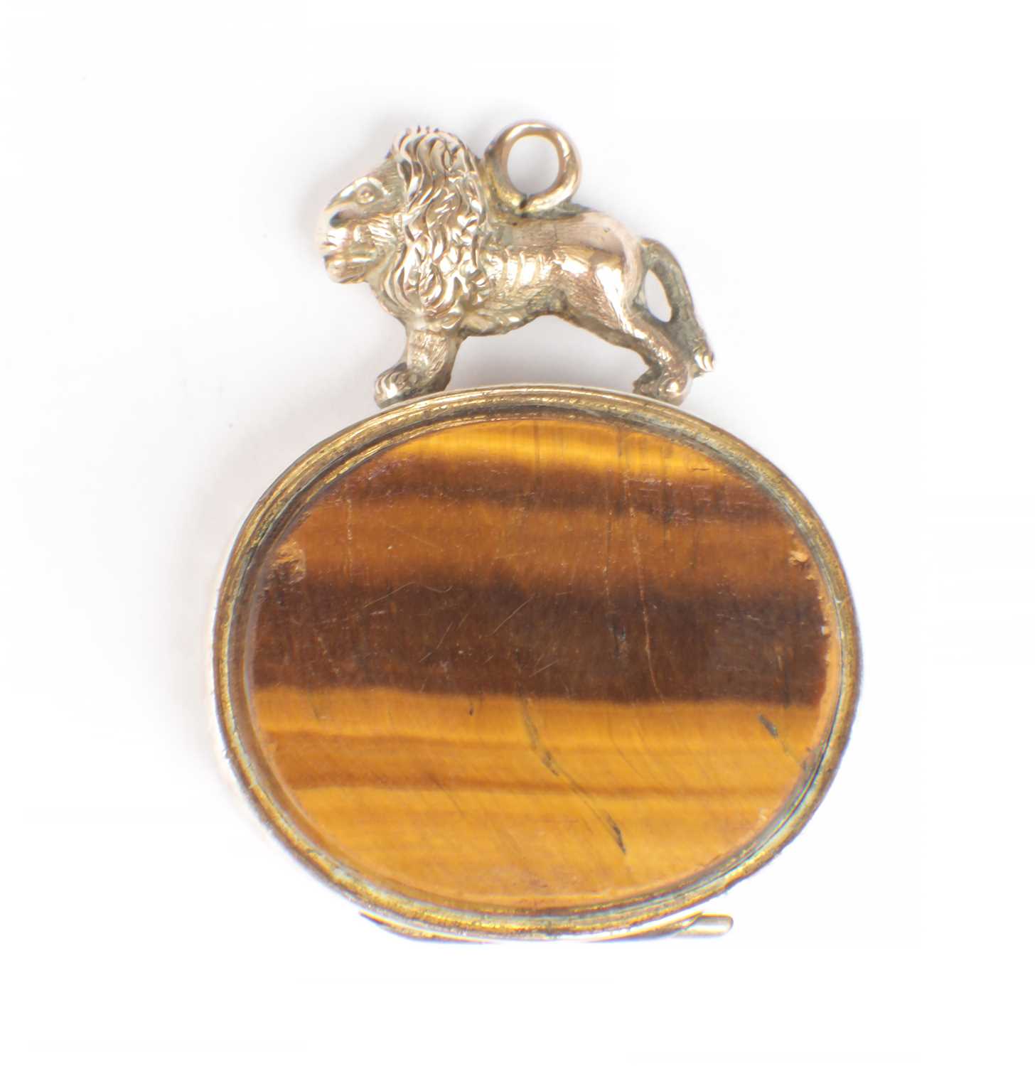 Lot 196 - A ROLLED GOLD TIGER EYE LOCKET