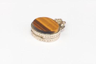 Lot 196 - A ROLLED GOLD TIGER EYE LOCKET