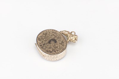Lot 196 - A ROLLED GOLD TIGER EYE LOCKET