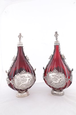 Lot 1 - A PAIR OF LATE 19TH CENTURY CONTINENTAL RUBY GLASS PILGRIM FLASKS WITH SILVER MOUNTS