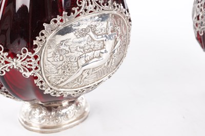 Lot 1 - A PAIR OF LATE 19TH CENTURY CONTINENTAL RUBY GLASS PILGRIM FLASKS WITH SILVER MOUNTS