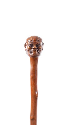 Lot 48 - AN ORIENTAL 19TH CENTURY CARVED WOOD WALKING STICK