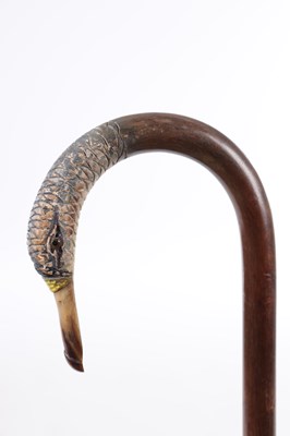 Lot 283 - A 19TH CENTURY CARVED AND PAINTED CROOK HANDLE WALKING STICK IN THE FORM OF A BIRD