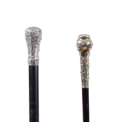 Lot 794 - TWO EARLY 20TH CENTURY GILT SILVER AND SILVER TOPPED WALKING STICKS