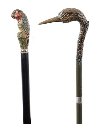 Lot 801 - TWO LATE 19TH CENTURY CARVED AND PAINTED BIRD HEAD-HANDLED WALKING STICKS