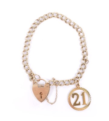 Lot 267 - A 9CT GOLD BRACELET WITH HEART SHAPED PADLOCK AND CHARM