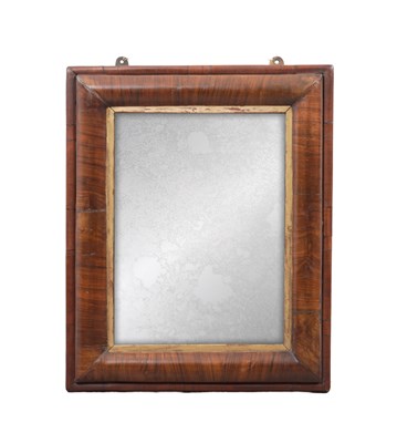 Lot 1292 - AN 18TH CENTURY WALNUT CUSHION FRAMED HANGING MIRROR
