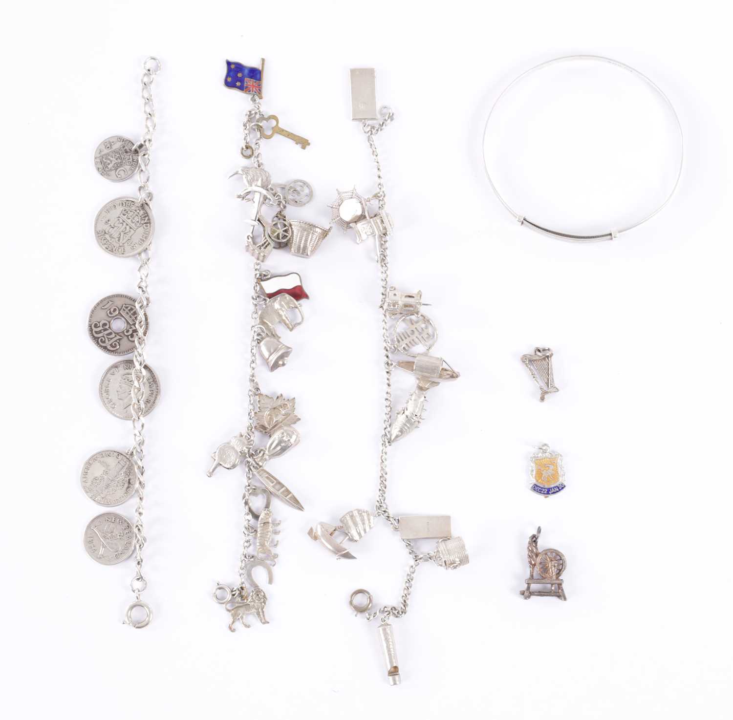 Lot 317 - A COLLECTION OF THREE SILVER BRACELETS AND A BANGLE
