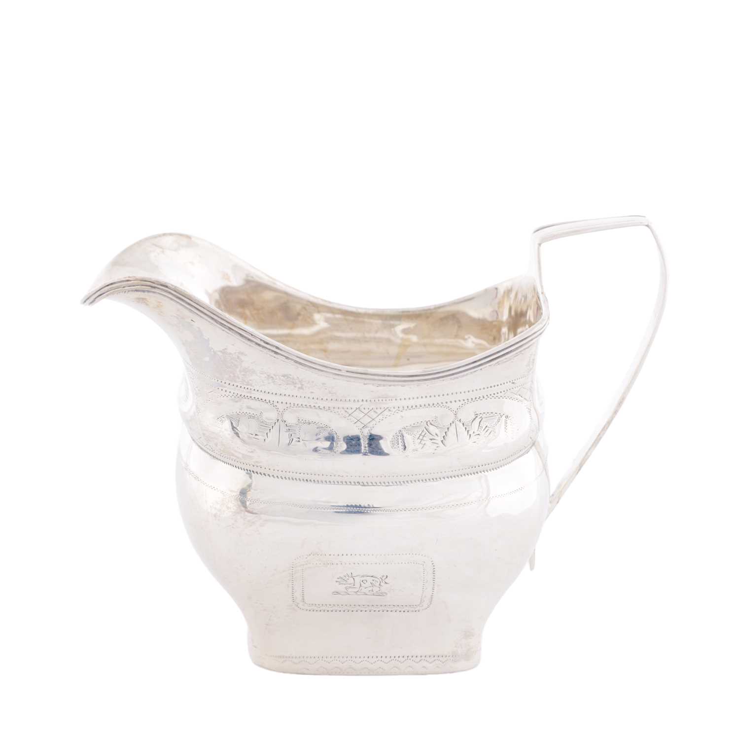 Lot 409 - A GEORGE III IRISH SILVER CREAM JUG