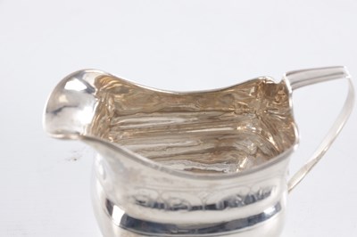 Lot 409 - A GEORGE III IRISH SILVER CREAM JUG