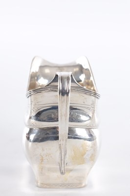 Lot 409 - A GEORGE III IRISH SILVER CREAM JUG