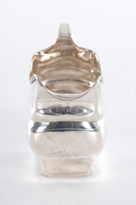 Lot 409 - A GEORGE III IRISH SILVER CREAM JUG