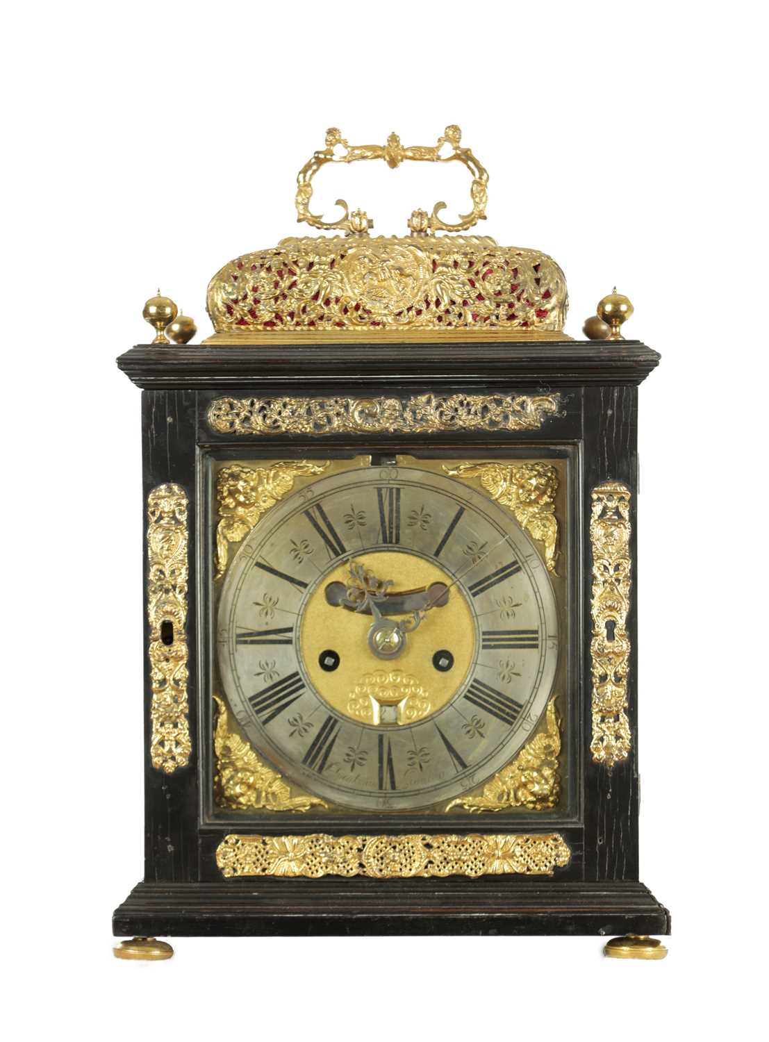 Lot 1119 - WILLIAM SPEAKMAN, LONDON. A GOOD WILLIAM AND MARY EBONY VENEERED BASKET TOP QUARTER STRIKING EIGHT-DAY BRACKET CLOCK