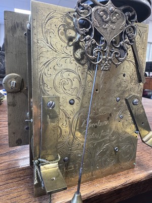 Lot 1119 - WILLIAM SPEAKMAN, LONDON. A GOOD WILLIAM AND MARY EBONY VENEERED BASKET TOP QUARTER STRIKING EIGHT-DAY BRACKET CLOCK